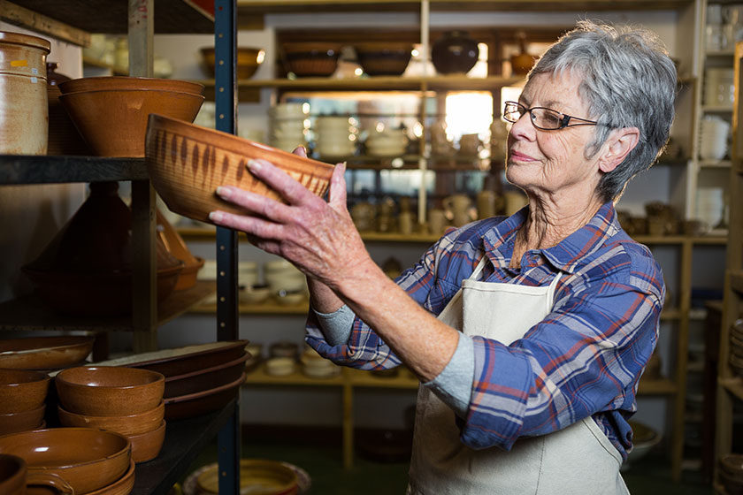 emale potter placing bowl