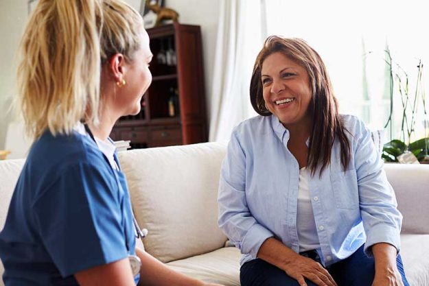 female healthcare worker sitting sofa