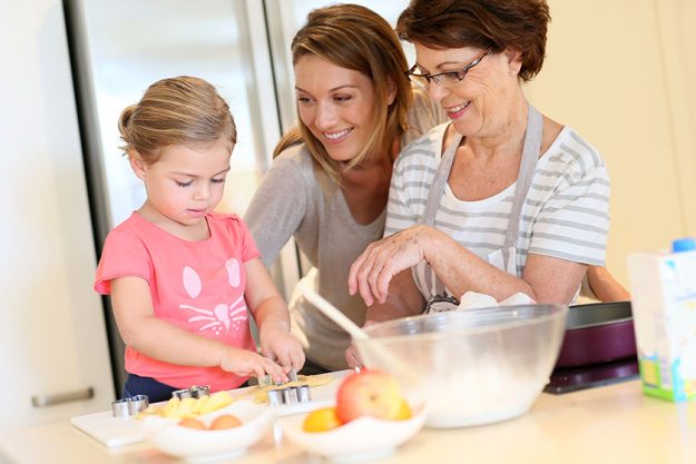 girl with mom and grandmother