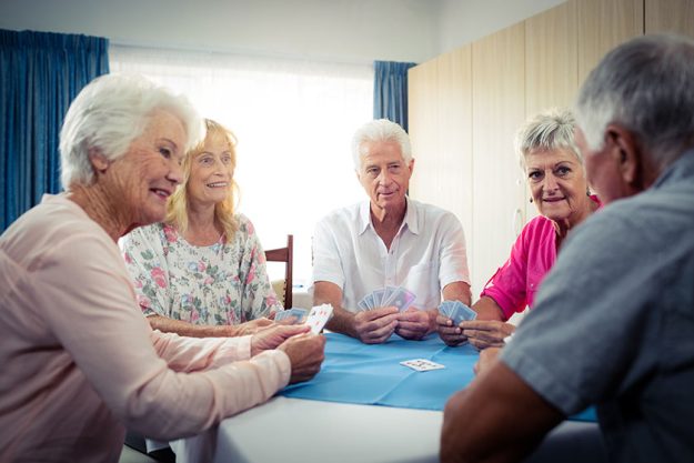 group of seniors playing cards