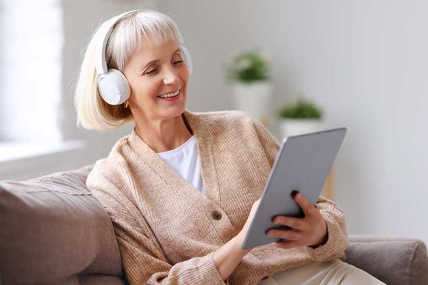 happy elderly female headphones smiling