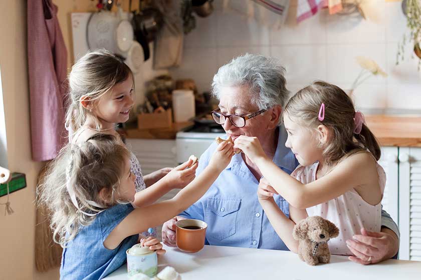 kids and senior woman eating