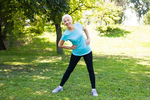 portrait senior woman doing streching