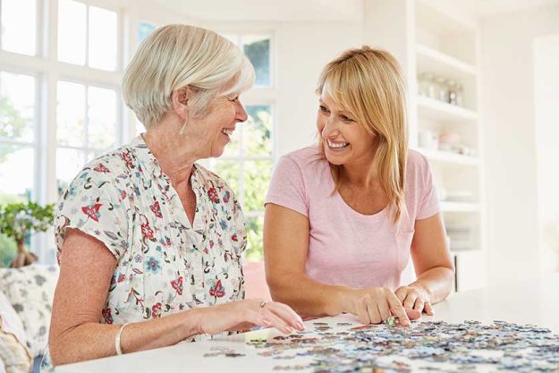 senior couple doing jigsaw puzzle