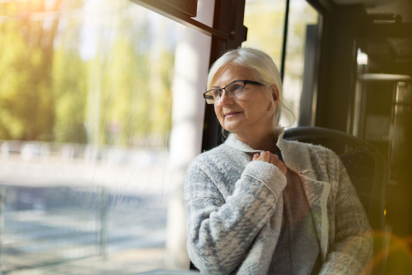senior woman looking window