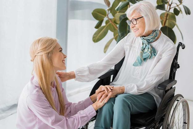 young woman sitting senior woman
