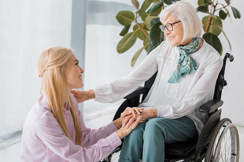 young woman sitting senior woman