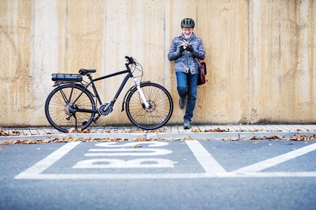 active senior man with electrobike