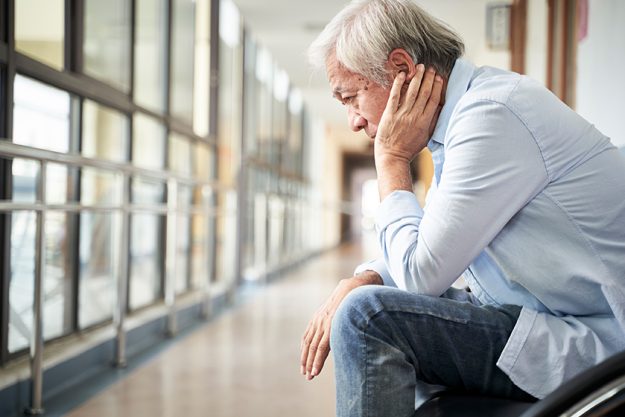 devastated senior asian man sitting devastated senior asian man sitting