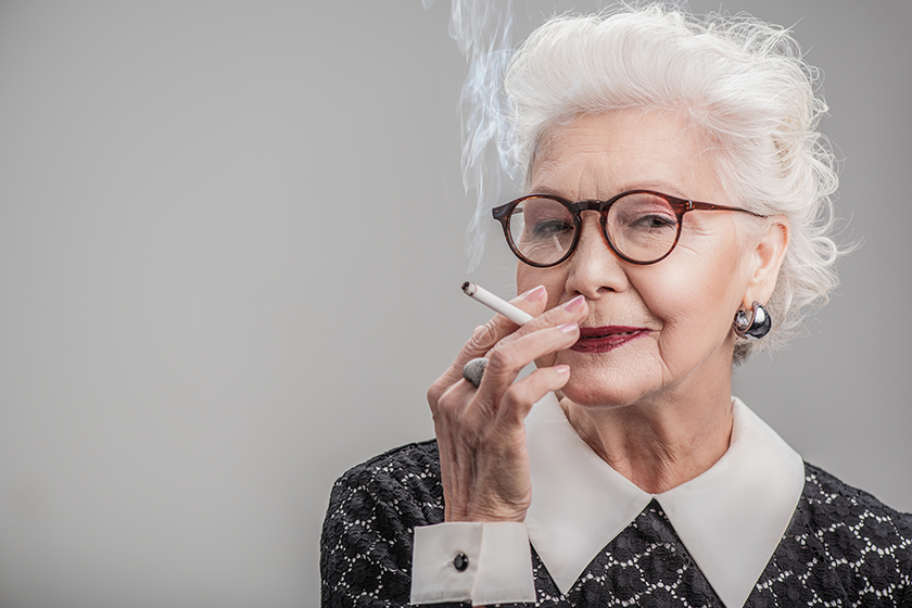 happy aged lady enjoying ciggy happy aged lady enjoying ciggy