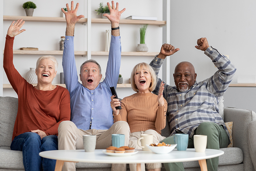 happy multiracial elderly people watching