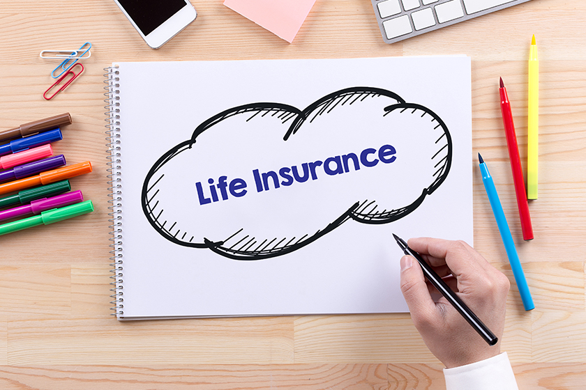 man writing in notepad man writing in notepad