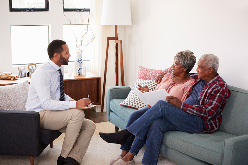 senior couple meeting male financial