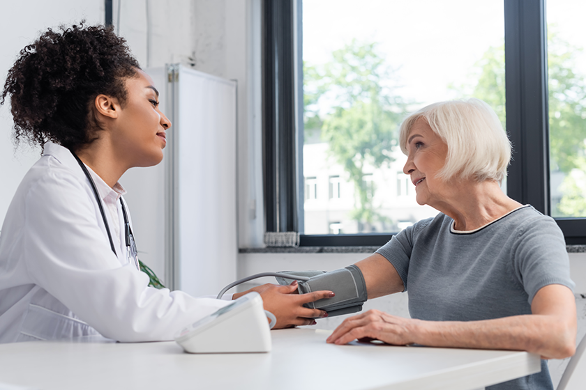 side view african american doctor looking smiling patient