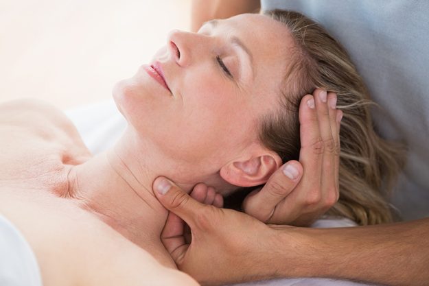 woman receiving neck massage woman receiving neck massage