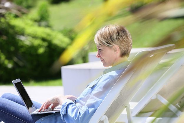 woman using laptop on long