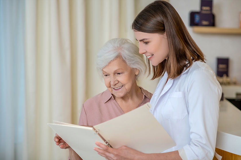 young dark haired cosmetologist discussing