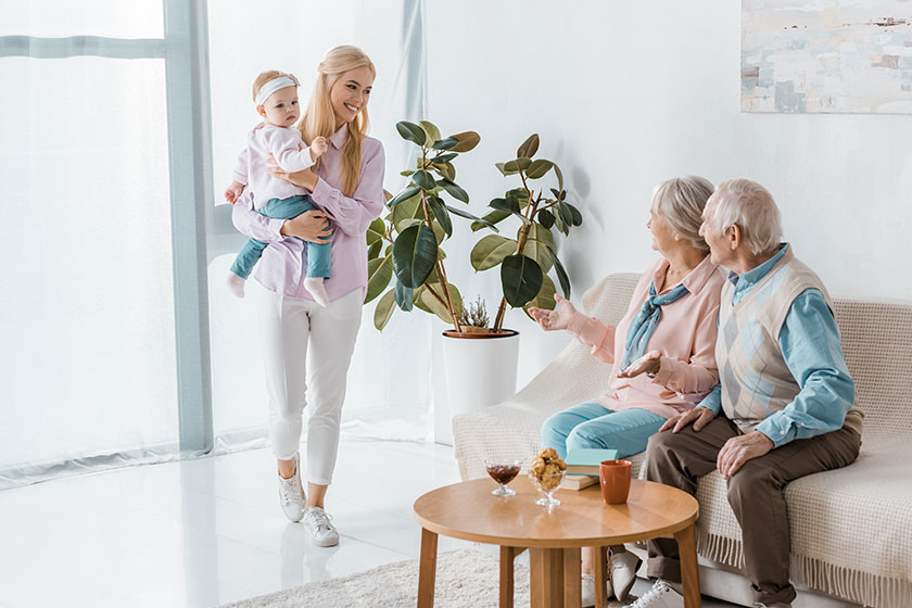 young woman holding toddler young woman holding toddler
