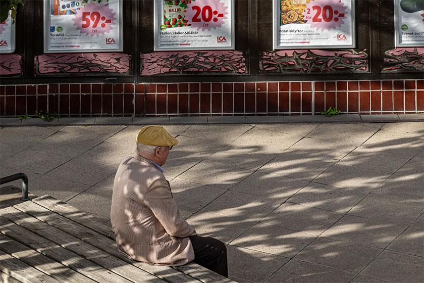 stockholm sweden aug 2023 senior man sits alone ica supermarket