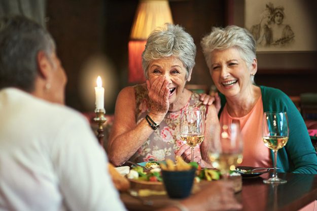 cropped shot group senior female friends enjoying lunch date
