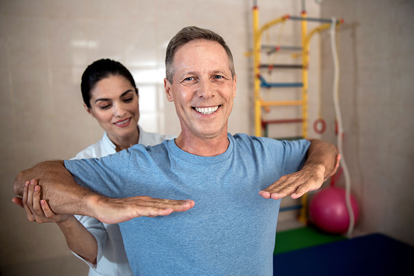 happy man is doing exercises with hands happy man is doing exercises with hands