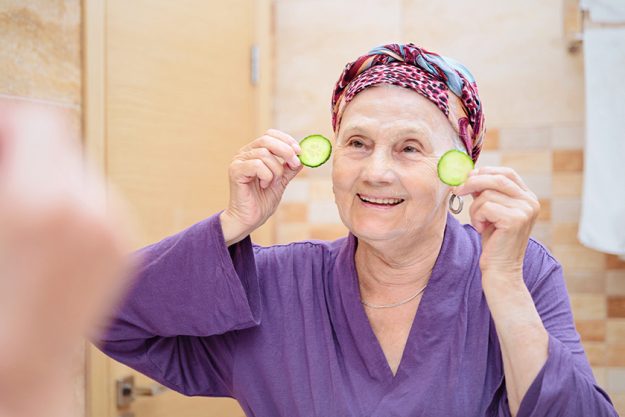 mature woman taking care her face senior woman standing mirror mature woman taking care her face senior woman standing mirror