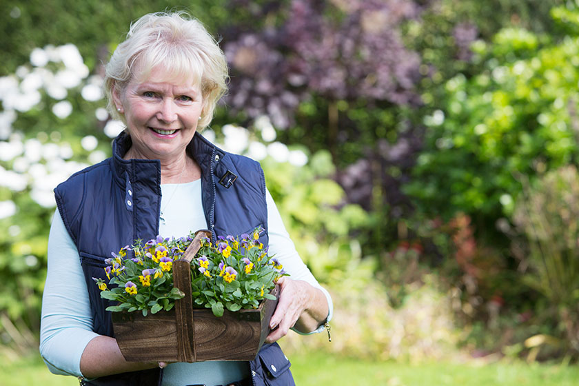 portrait of senior woman working in garden 1