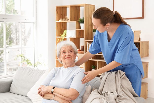 senior woman female caregiver home senior woman female caregiver home