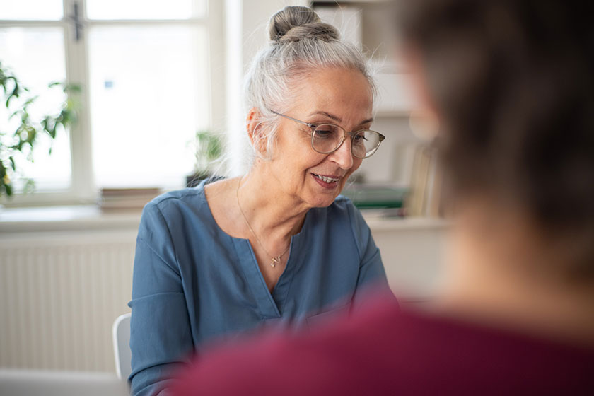 senior woman recruiter smiling during the job interview senior woman recruiter smiling during the job interview