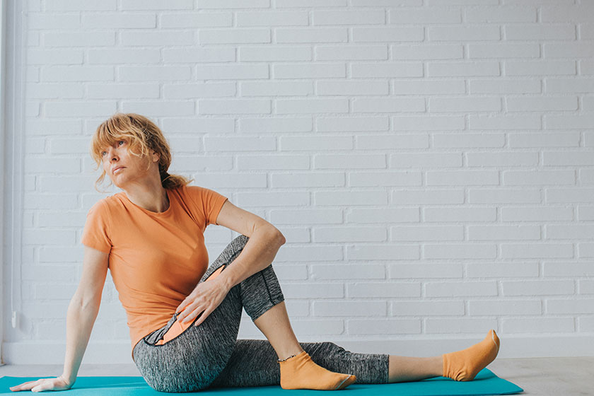 adult woman doing sports gymnastics home gym space text