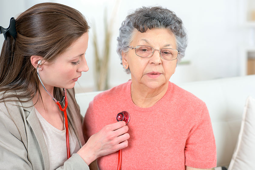 checking senior woman s heartbeat