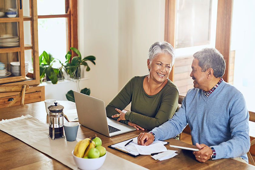 finance laptop happy senior couple bills paperwork documents life insurance finance laptop happy senior couple bills paperwork documents life insurance