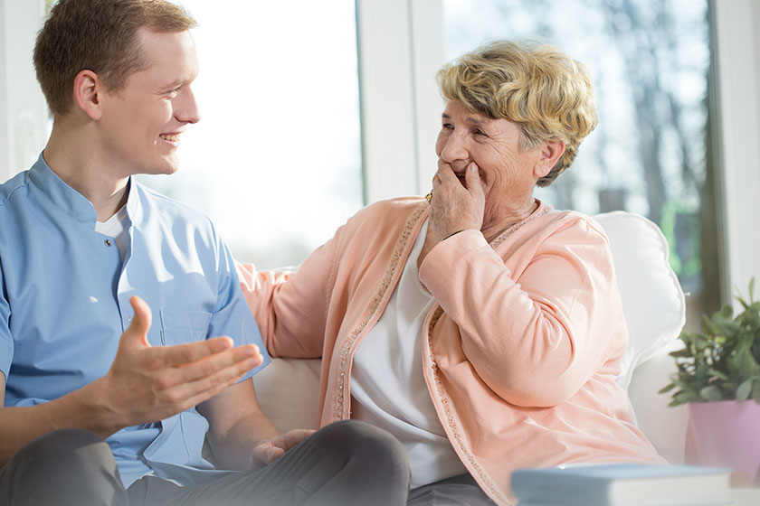 man and elderly woman laughing