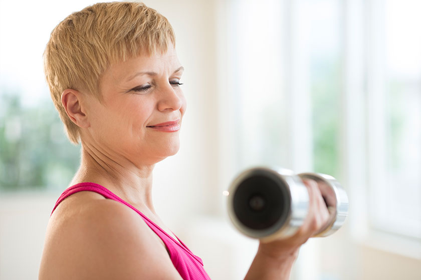 mature woman lifting weights
