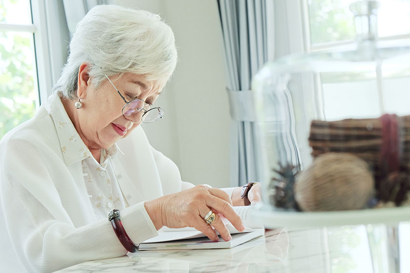 senior woman reading a book