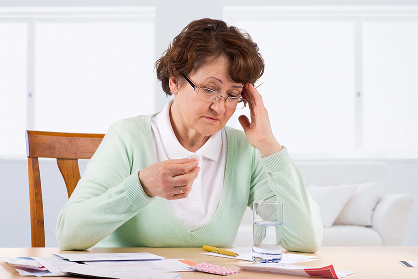 elderly woman worry about bill notice