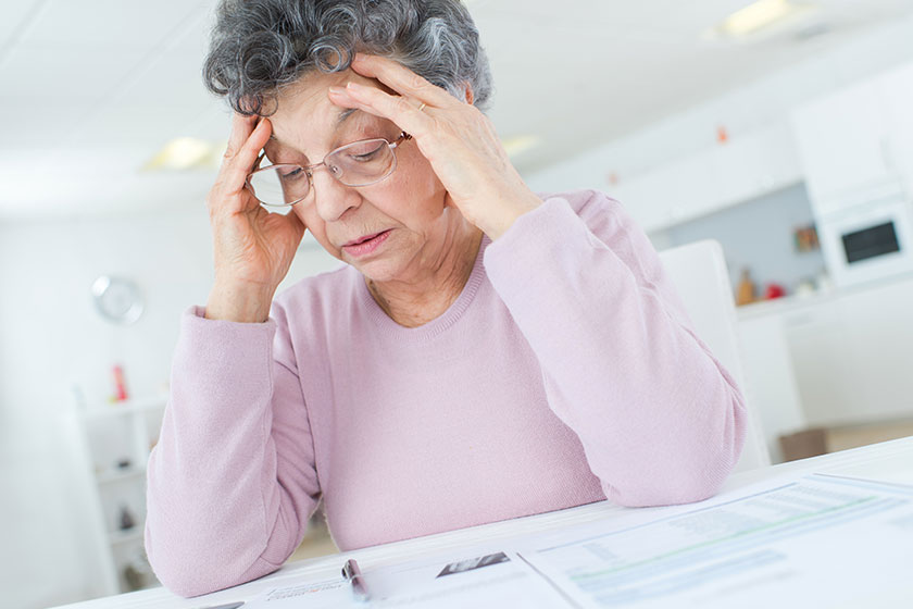 frustrated old lady has pain head