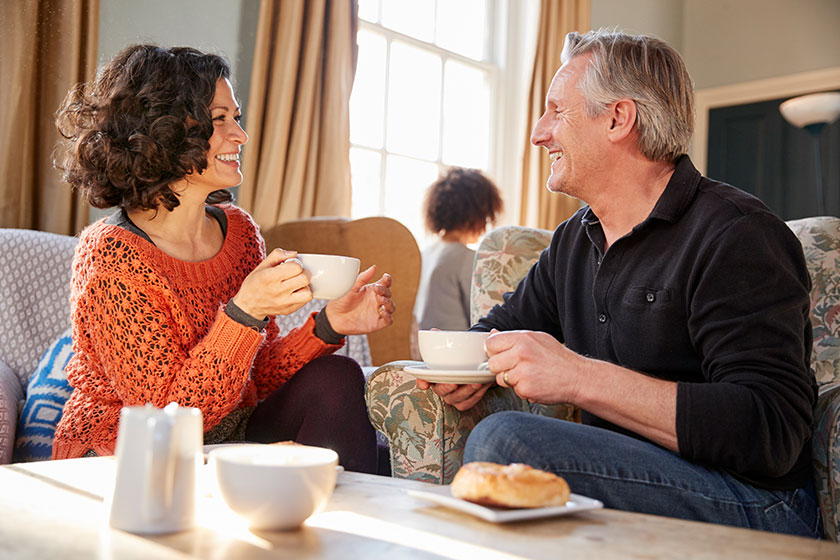 middle aged couple sitting table coffee shop