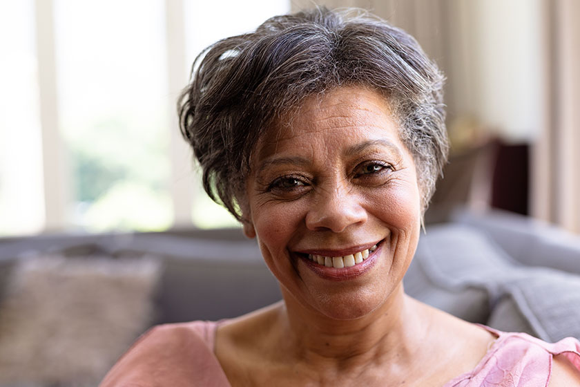 portrait senior mixed race woman enjoying her time home sitting