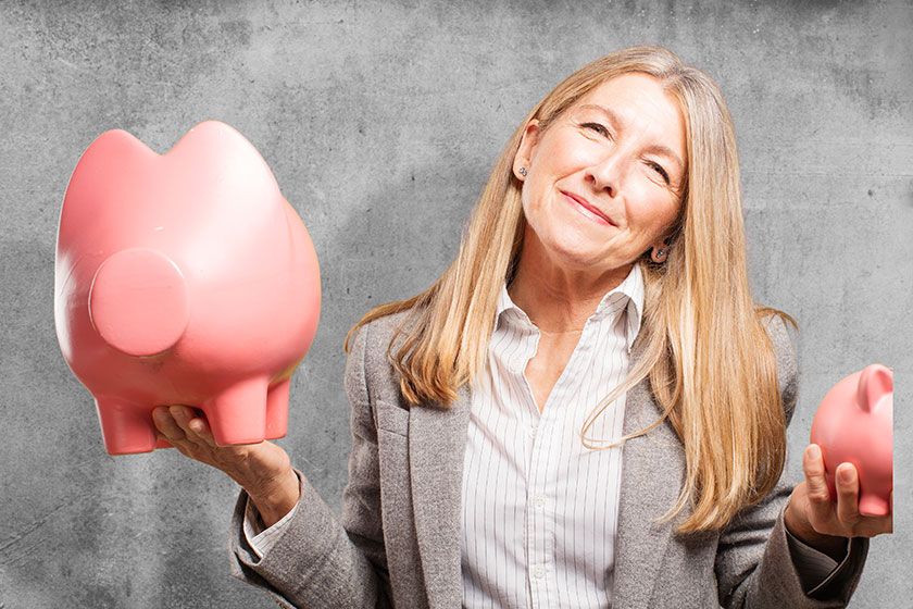 senior beautiful woman with piggy banks