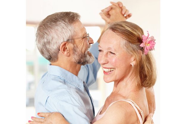 senior couple dancing happy home