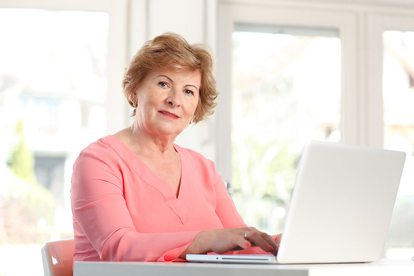senior woman working on laptop