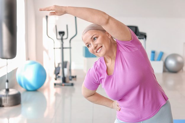 sporty mature woman training gym