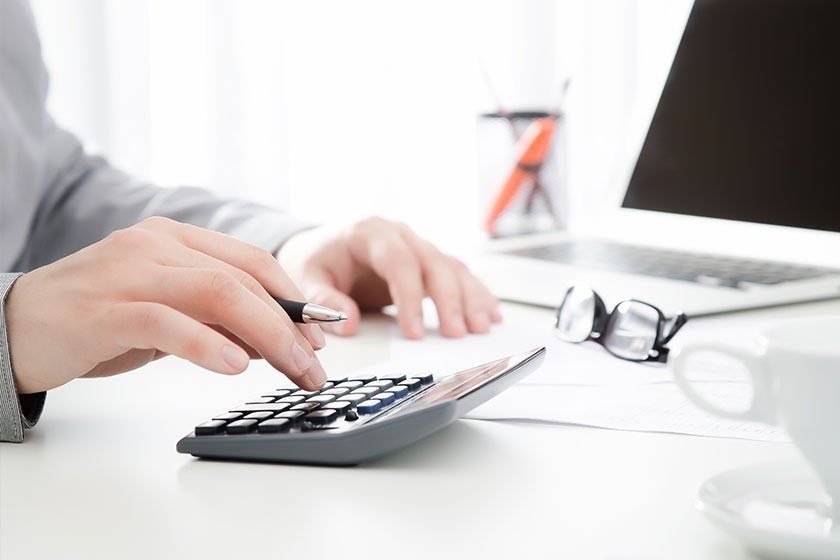 working in the office with calculator