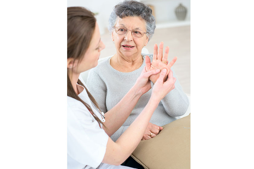 checking an old lady s hands checking an old lady s hands