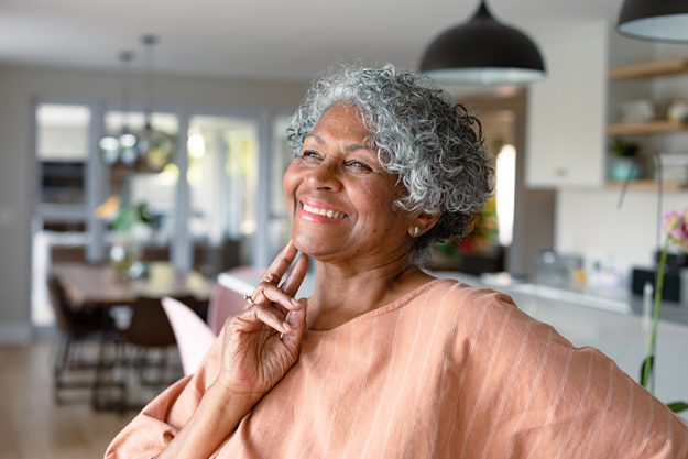 happy african american senior woman touching face standing standing kitchen happy african american senior woman touching face standing standing kitchen