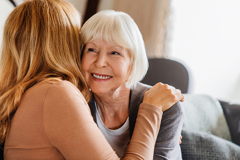 head shot happy old senior woman hugging her adult daughter head shot happy old senior woman hugging her adult daughter