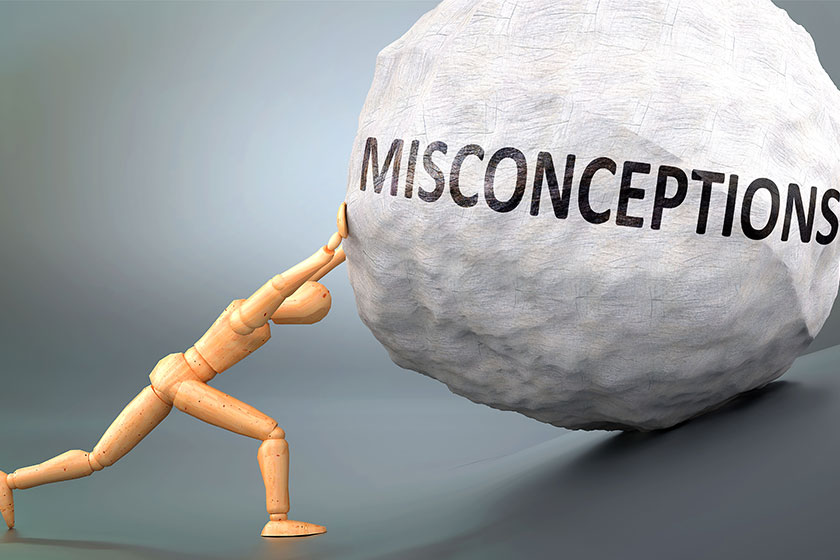 misconceptions painful human condition pictured wooden human figure pushing heavy