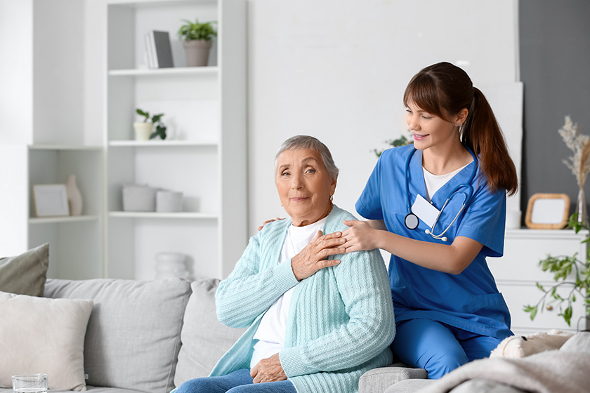 senior woman caregiver hugging home senior woman caregiver hugging home