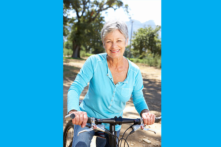 senior woman on country bike ride